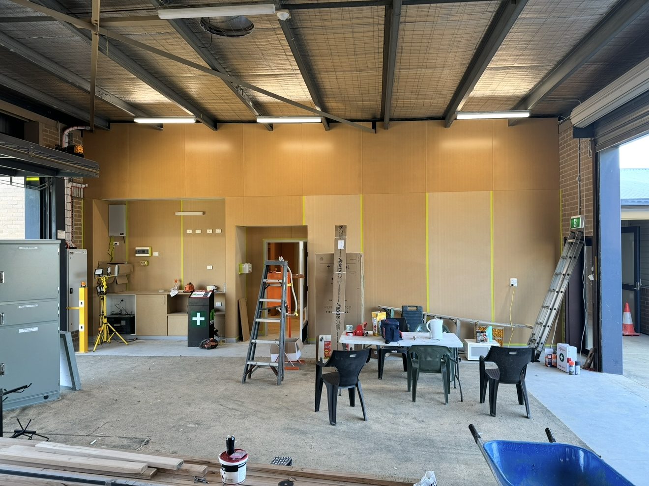 Interior timber-look wall cladding panels in a workshop fit-out