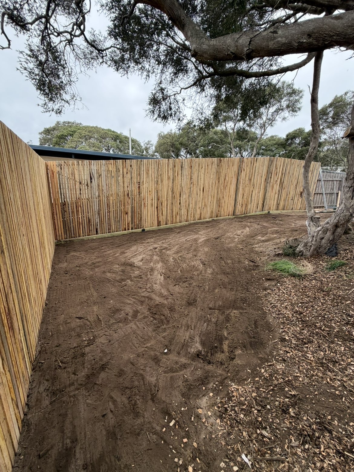 Curved timber fence