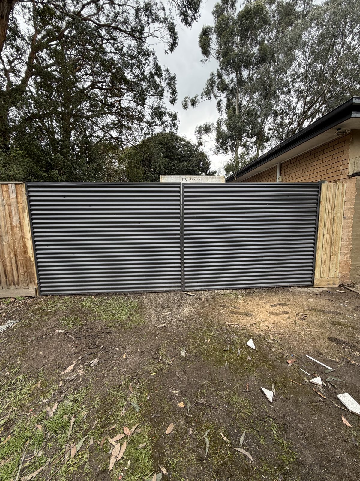 Double corrugated steel driveway gate