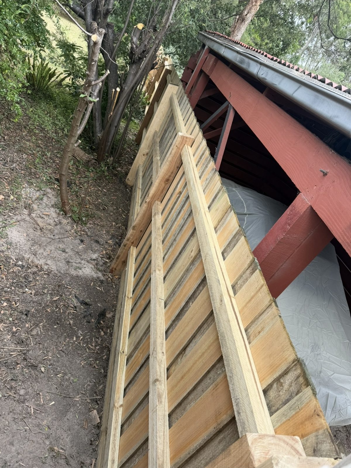 Timber slat fence panels under construction