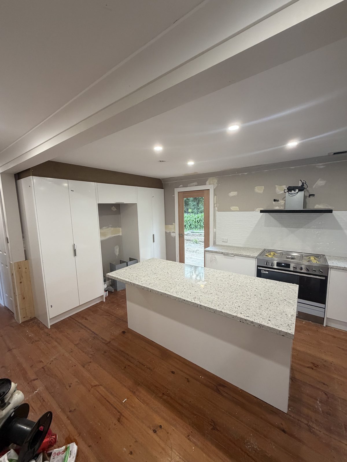 Kitchen renovation with gas cooktop and stone benchtop