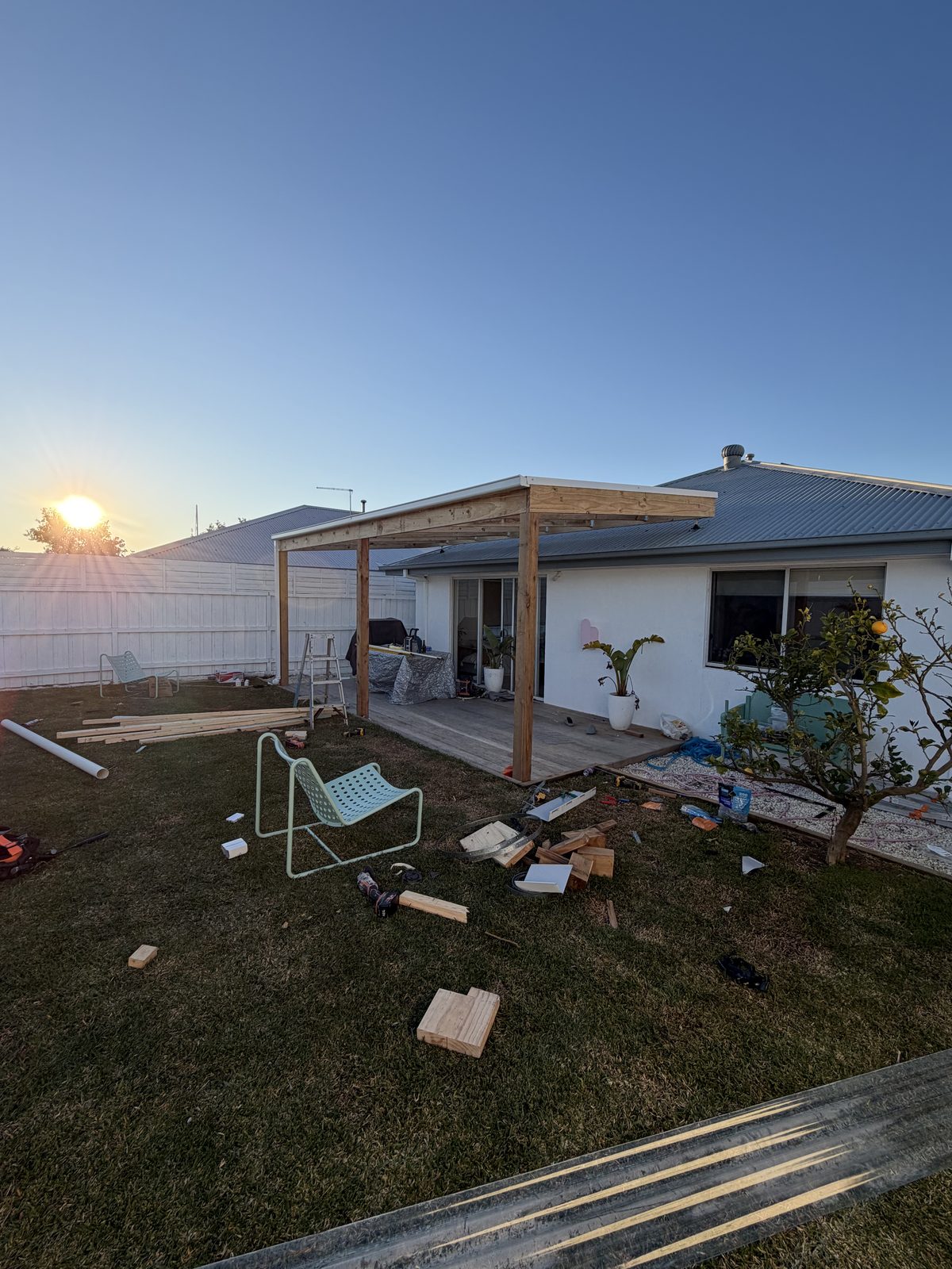 Freestanding timber patio roof at sunset